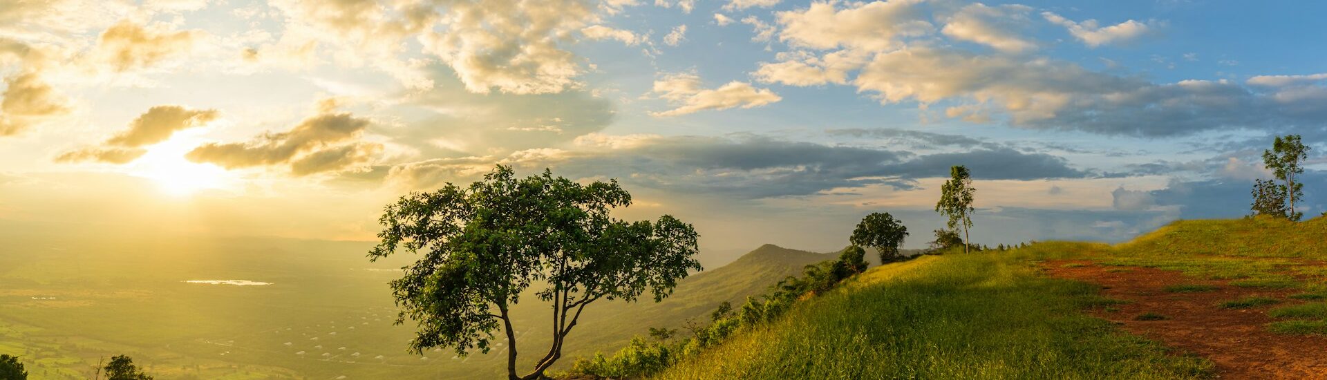 Mountain landscape with colorful vivid sunset on the cloudy sk